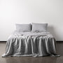 Foxtrot Home French Flax Linen styled in a bedroom with Navy Stripes Pillowcases.