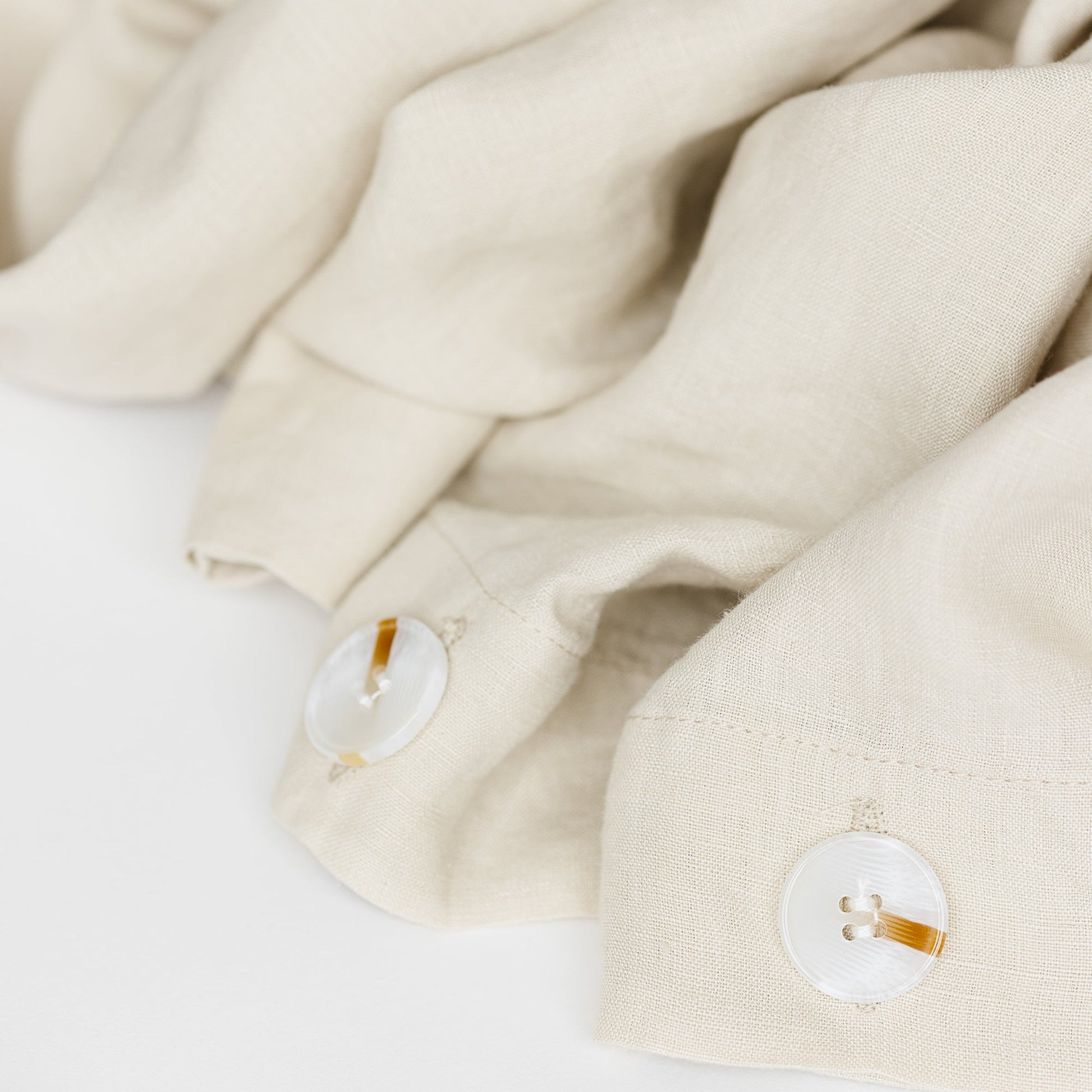 Foxtrot Home French Flax Linen styled in a bedroom with Oat Duvet.