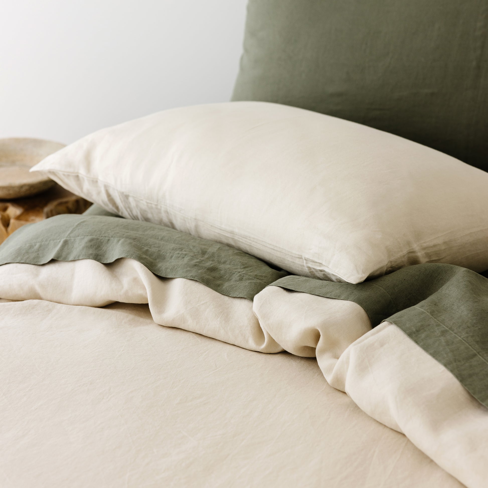 Foxtrot Home French Flax Linen styled in a bedroom with Oat Duvet.