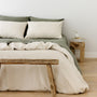 Foxtrot Home French Flax Linen styled in a bedroom with Oat Duvet.