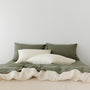 Foxtrot Home French Flax Linen styled in a bedroom with Oat Duvet.