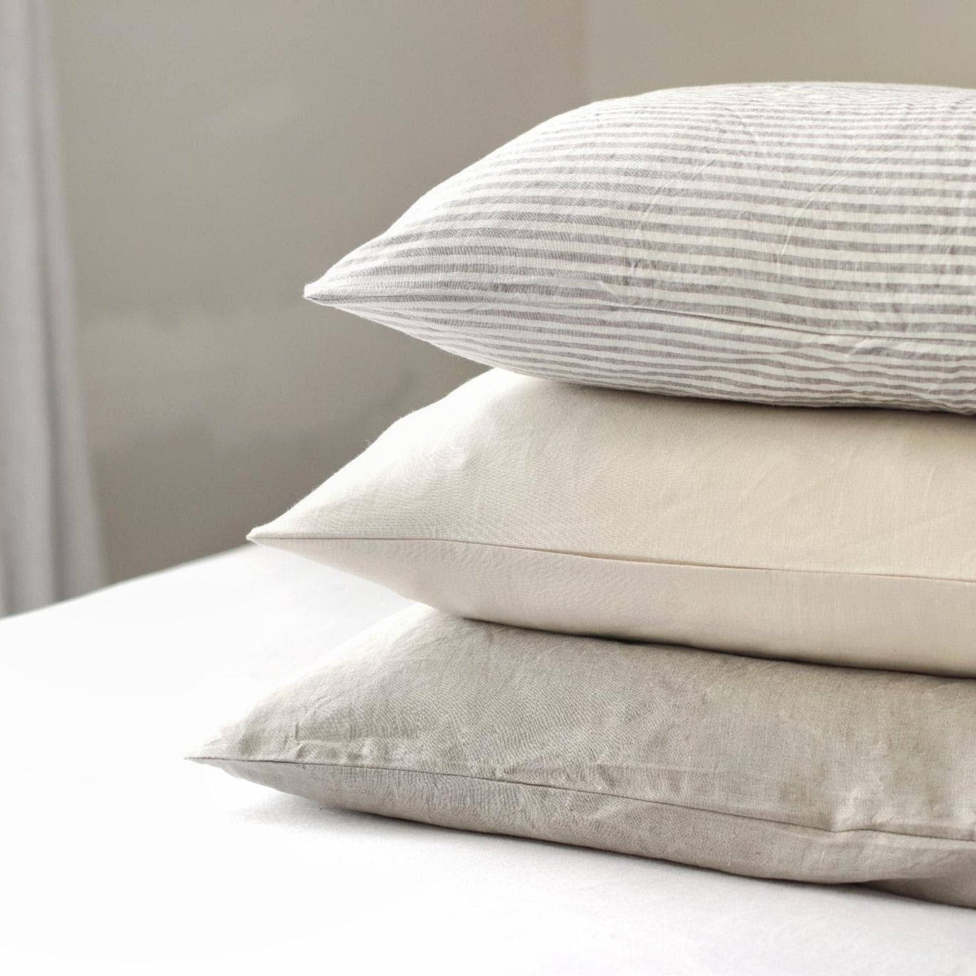 Foxtrot Home French Flax Linen styled in a bedroom with Oat Duvet.