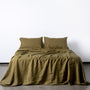Foxtrot Home French Flax Linen styled in a bedroom with Olive Green Pillowcases.