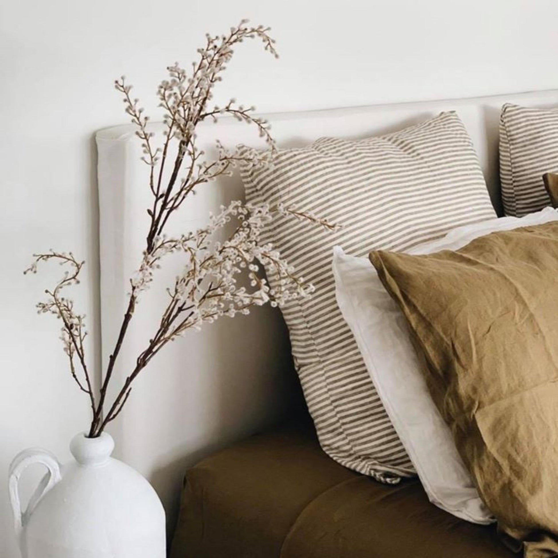 Foxtrot Home French Flax Linen styled in a bedroom with Olive Green Pillowcases.