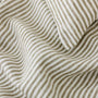 Foxtrot Home French Flax Linen styled in a bedroom with Olive Green Stripes Pillowcases.