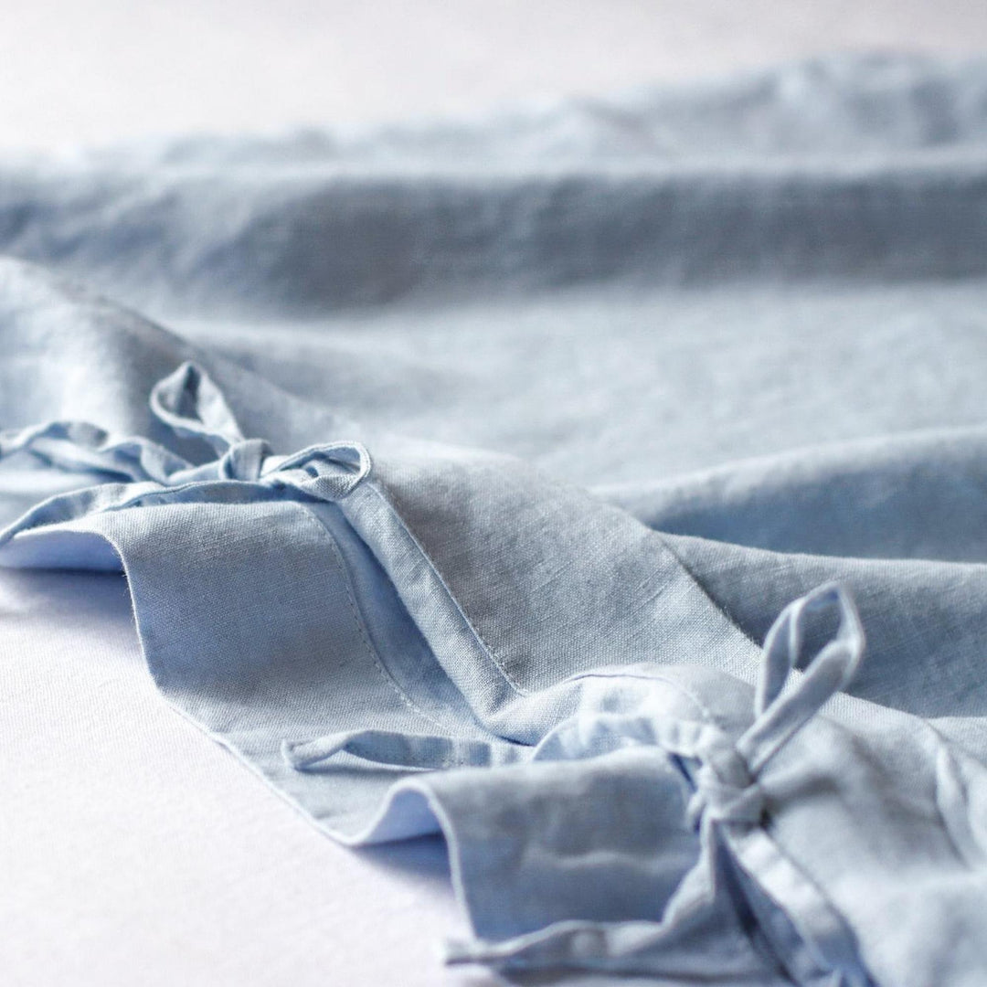 Foxtrot Home French Flax Linen styled in a baby's bedroom with a Powder Blue Cot Duvet.