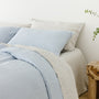 Foxtrot Home French Flax Linen styled in a bedroom with Powder Blue Pillowcases.