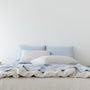 Foxtrot Home French Flax Linen styled in a bedroom with Powder Blue Pillowcases.