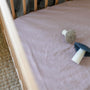 Foxtrot Home French Flax Linen styled in a baby's bedroom with Rosewood Pink Cot Duvet.