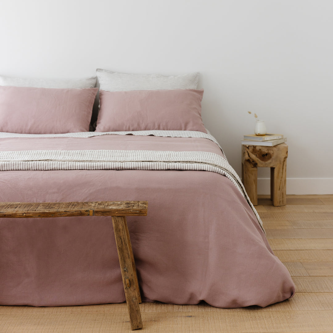 Foxtrot Home French Flax Linen styled in a bedroom with Rosewood Duvet, Grey Stripes and Pillowcases.