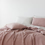 Foxtrot Home French Flax Linen styled in a bedroom with Rosewood Duvet, Grey Stripes and Pillowcases.