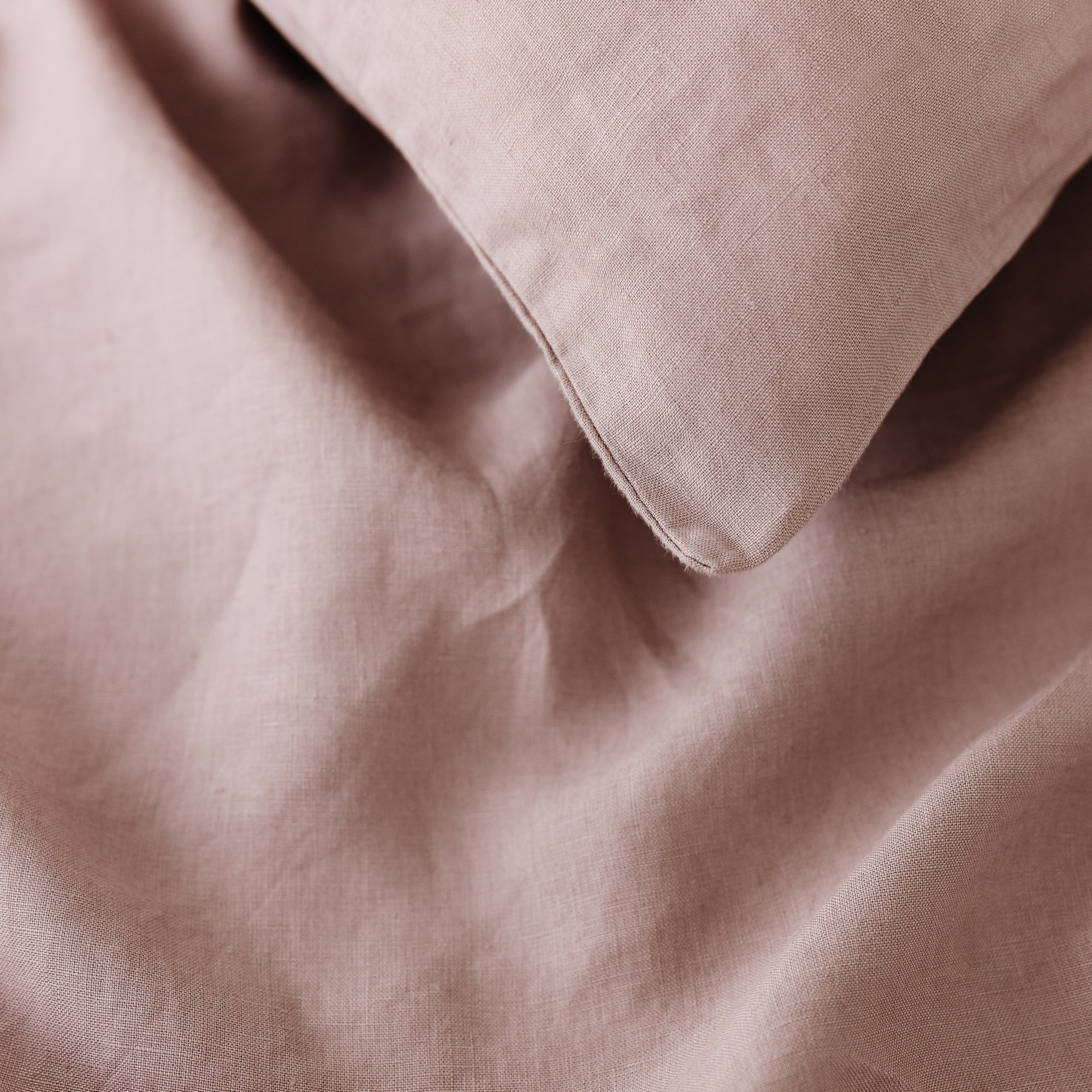 Foxtrot Home French Flax Linen styled in a bedroom with Rosewood Pink Pillowcases.