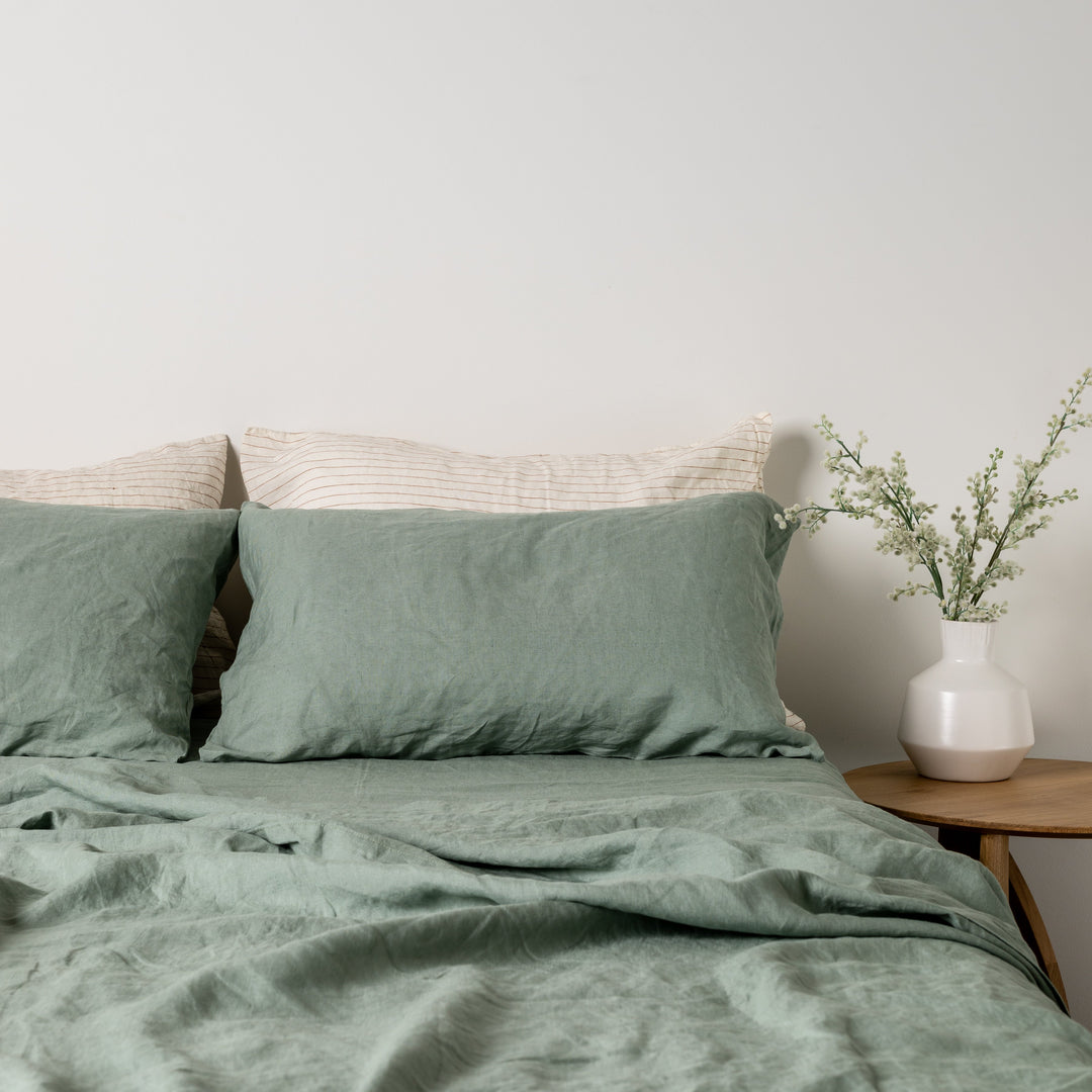 Foxtrot Home French Flax Linen styled in a bedroom with Sage Green Pillowcases.