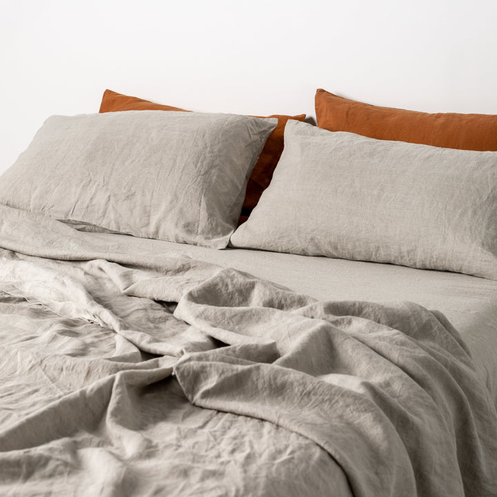 Foxtrot Home French Flax Linen styled in a bedroom with Tobacco Pillowcases.