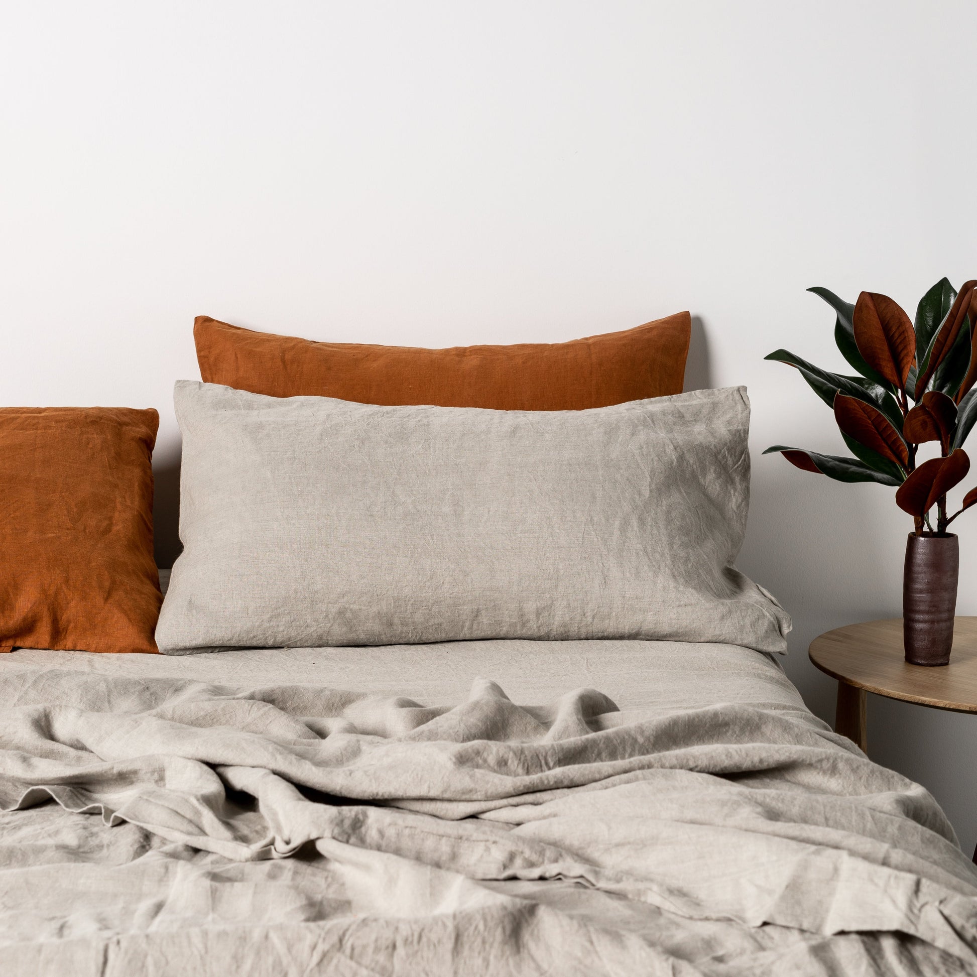 Foxtrot Home French Flax Linen styled in a bedroom with Tobacco Pillowcases.
