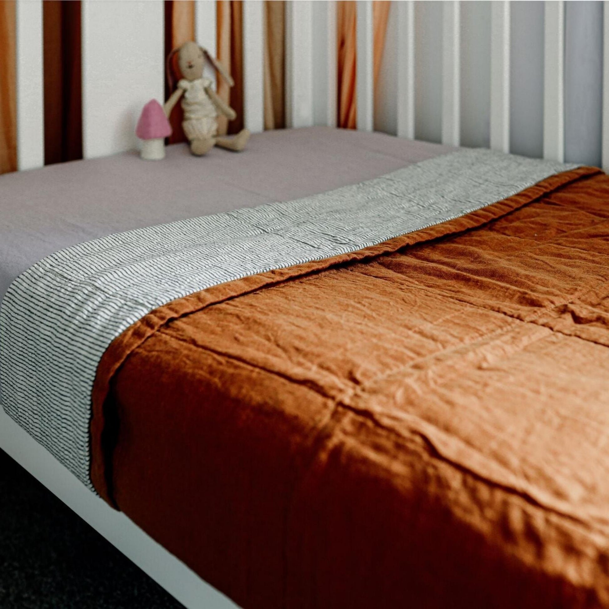 Foxtrot Home French Flax Linen styled in a bedroom with Tobacco and Pinstripes Quilt.