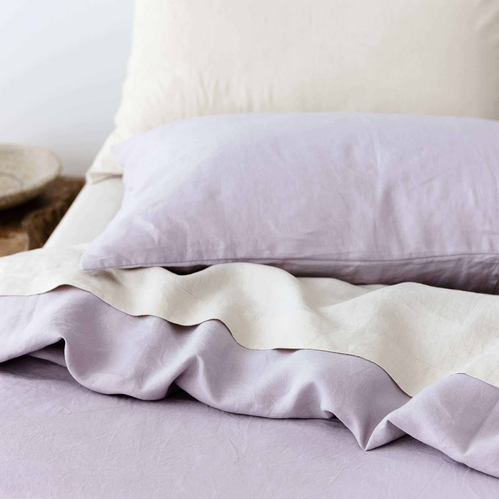 Foxtrot Home French Flax Linen styled in a bedroom with Lilac Purple Duvet.