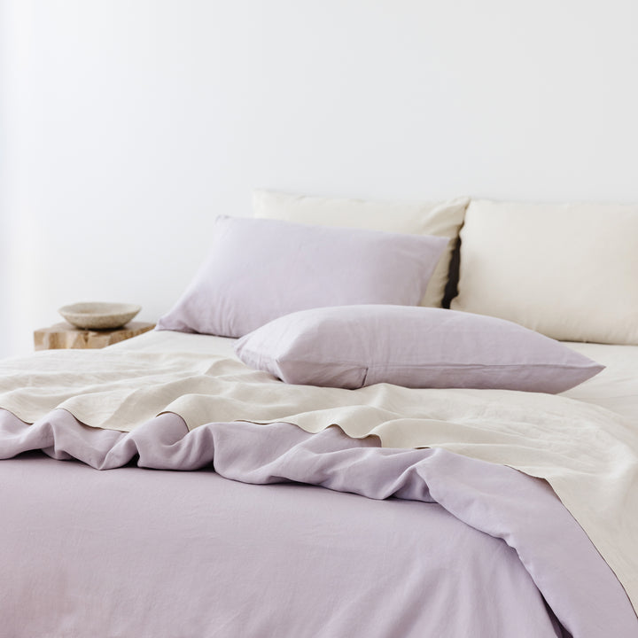 Foxtrot Home French Flax Linen styled in a bedroom with Lilac Purple Duvet.