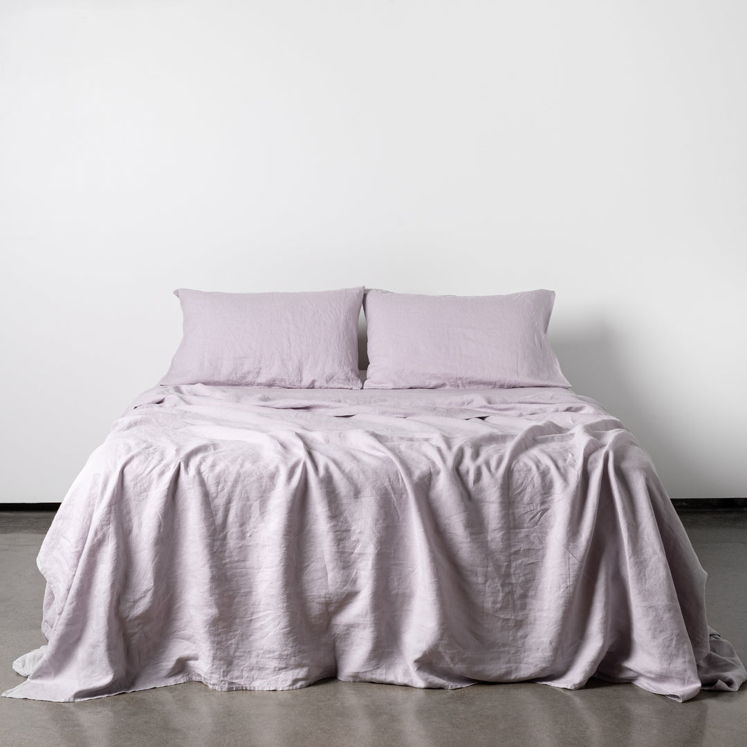 Foxtrot Home French Flax Linen styled in a bedroom with Lilac Purple Sheets Sets.