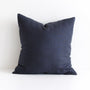 Foxtrot Home French Flax Linen styled in a bedroom with Midnight Blue Cushion Cover.