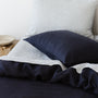Foxtrot Home French Flax Linen styled in a bedroom with Midnight Blue Duvet.