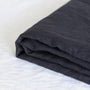 Foxtrot Home French Flax Linen styled in a bedroom with Midnight Blue Fitted Sheet.