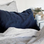 Foxtrot Home French Flax Linen styled in a bedroom with Midnight Blue Pillowcases.