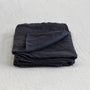 Foxtrot Home French Flax Linen styled in a bedroom with Midnight Blue Pillowcases.