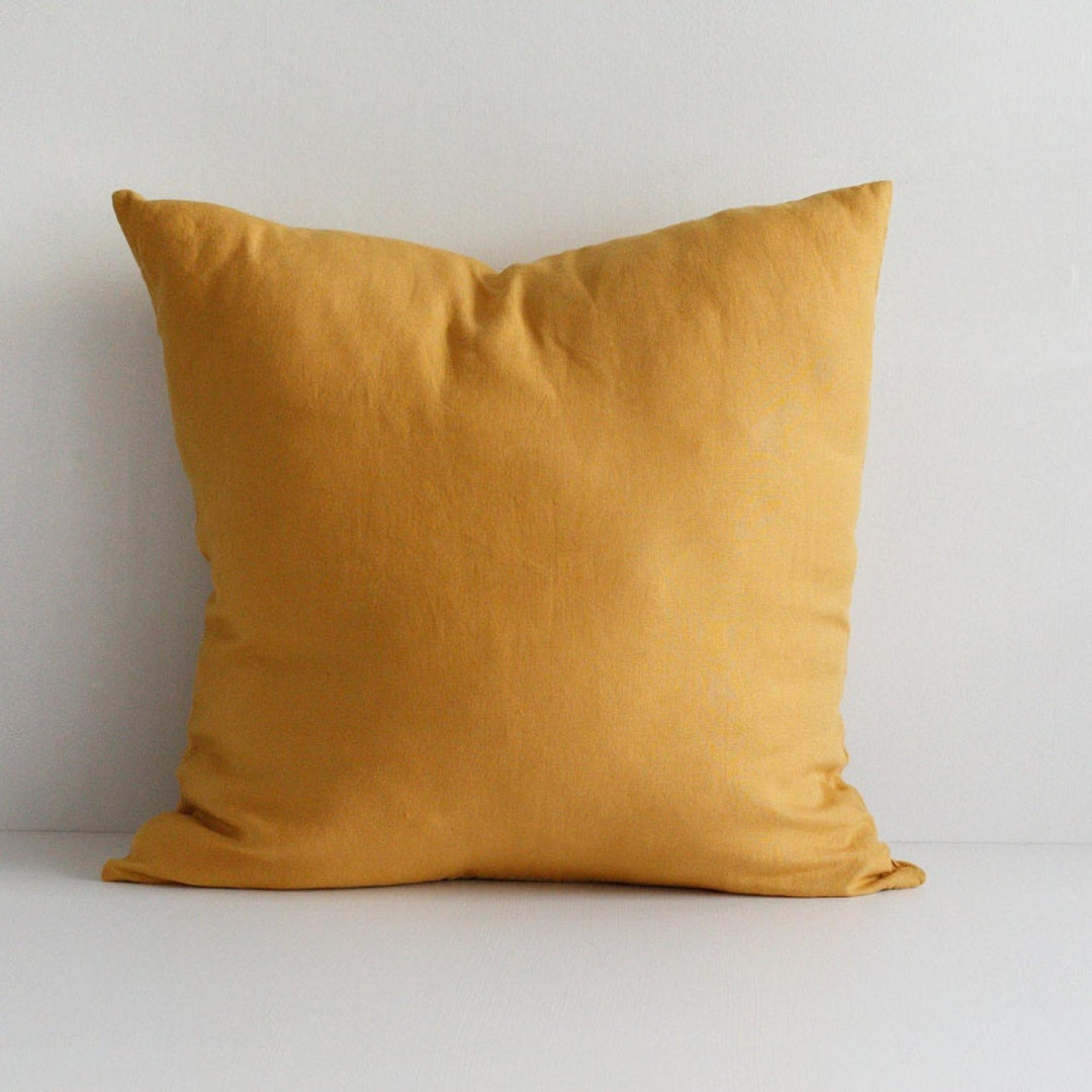 Foxtrot Home French Flax Linen styled in a bedroom with Mustard Yellow Cushion Cover.