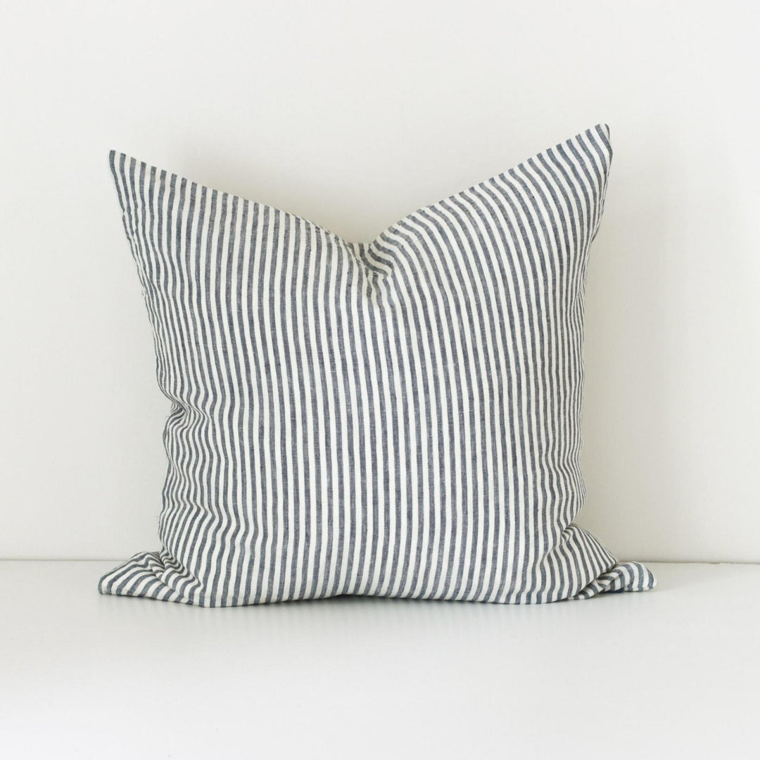 Foxtrot Home French Flax Linen styled in a bedroom with Navy Stripes Cushion Cover.