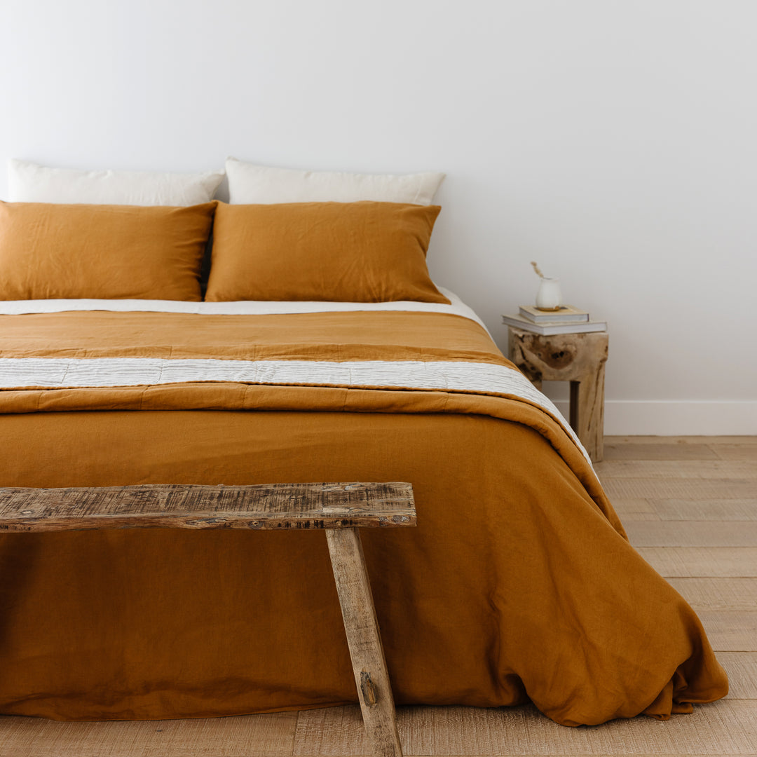 Foxtrot Home French Flax Linen styled in a bedroom with Ochre Pillowcases.