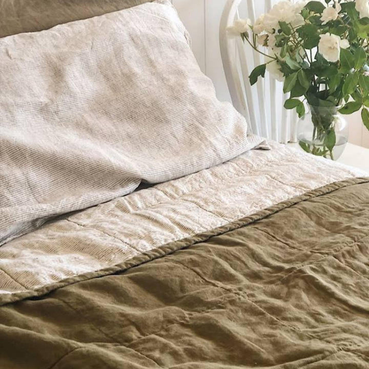Foxtrot Home French Flax Linen styled in a bedroom with Olive Green & Pinstripes Quilt.