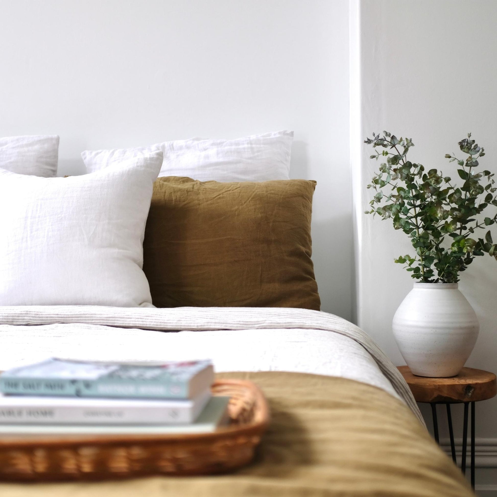 Foxtrot Home French Flax Linen styled in a bedroom with Olive Green Duvet, Navy Blue Sheets Set and Pillowcases.