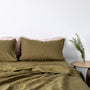 Foxtrot Home French Flax Linen styled in a bedroom with Olive Green Fitted Sheet.