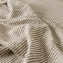 Foxtrot Home French Flax Linen styled in a bedroom with Olive Green Stripes Fitted Sheet.