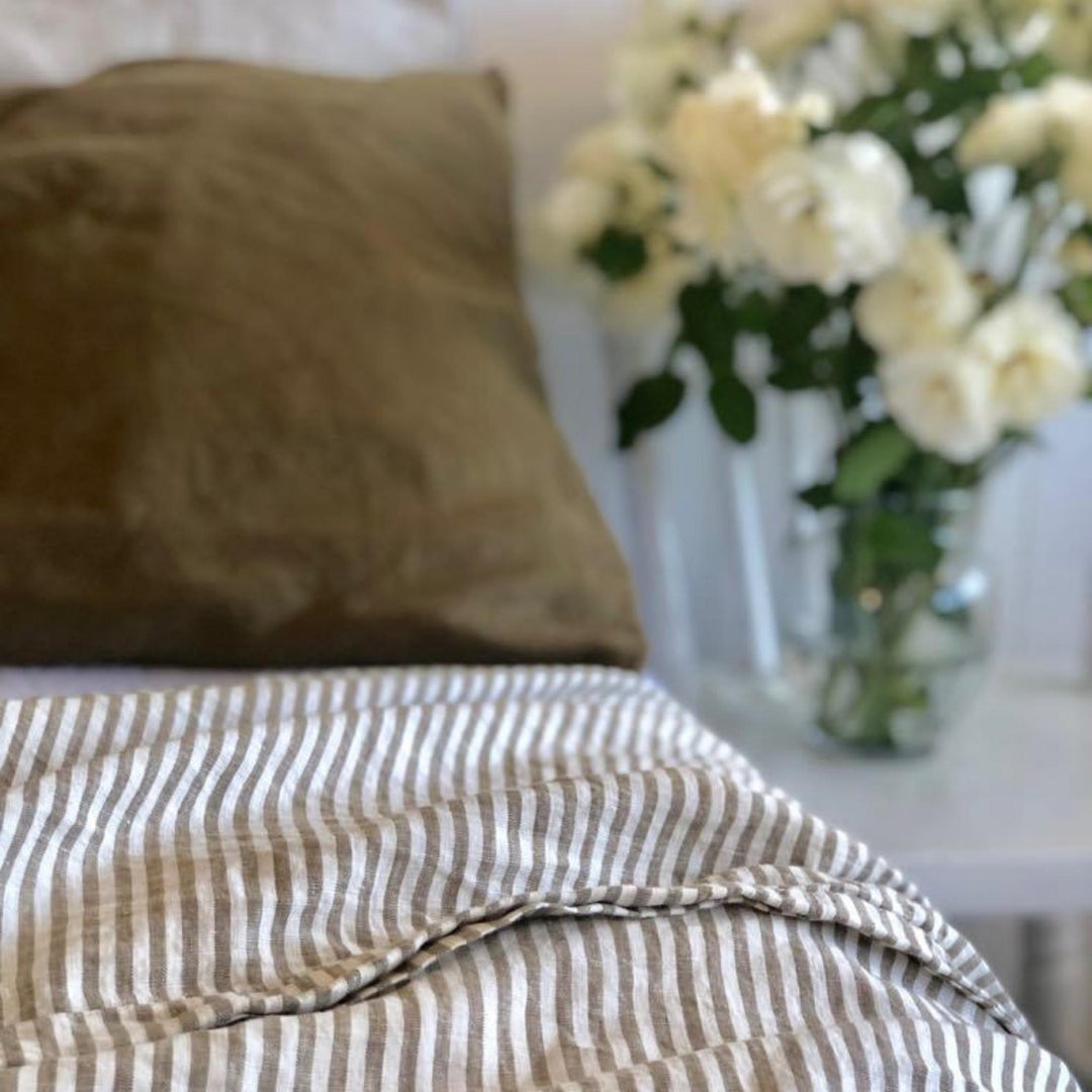 Foxtrot Home French Flax Linen styled in a bedroom with Olive Green Stripes Fitted Sheet.