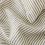 Foxtrot Home French Flax Linen styled in a bedroom with Olive Green Stripes Cushion Cover.