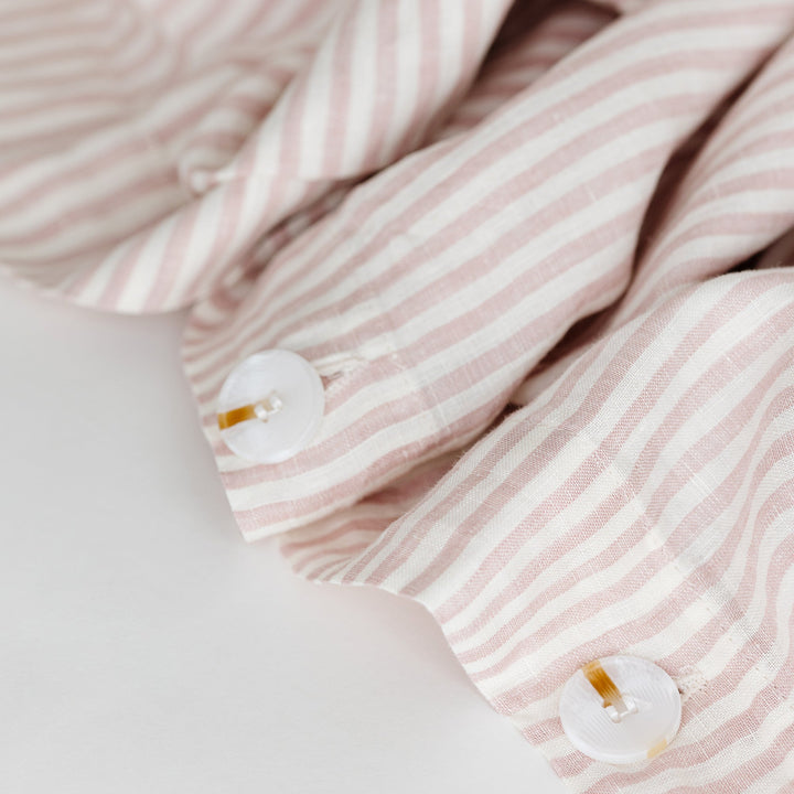 Foxtrot Home French Flax Linen styled in a bedroom with Pink Stripes Duvet.