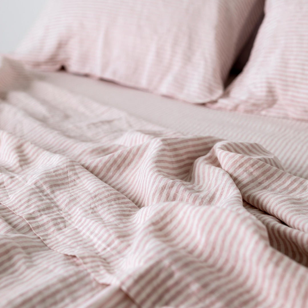 Foxtrot Home French Flax Linen styled in a bedroom with Pink Stripes Fitted Sheet.