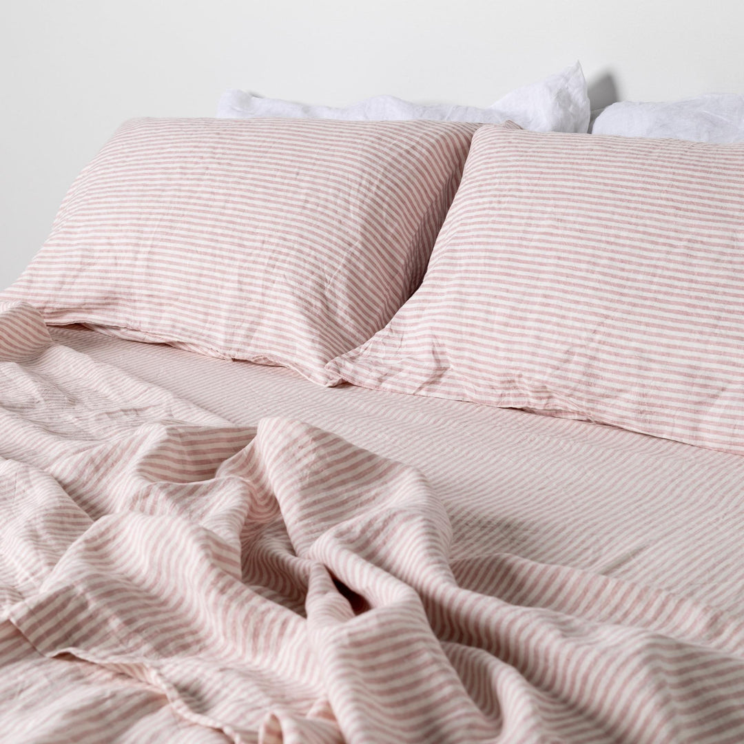 Foxtrot Home French Flax Linen styled in a bedroom with Pink Stripes Flat Sheet.