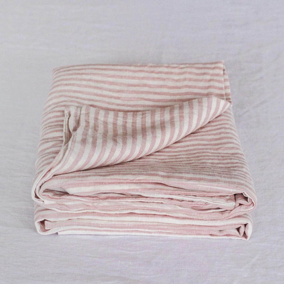 Foxtrot Home French Flax Linen styled in a bedroom with Pink Stripes Pillowcases.