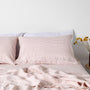 Foxtrot Home French Flax Linen styled in a bedroom with Pink Stripes Sheet Sheets.