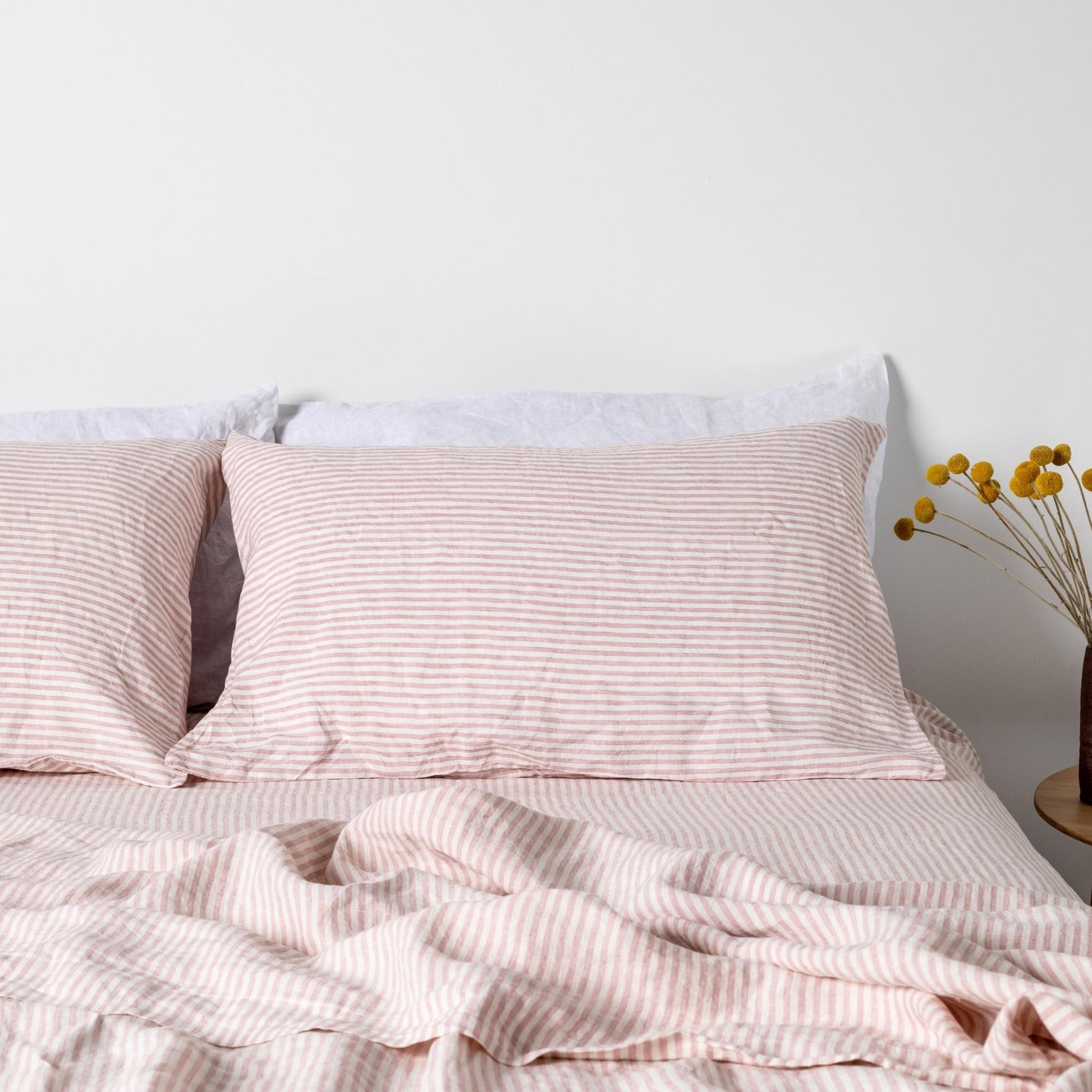 Foxtrot Home French Flax Linen styled in a bedroom with Pink Stripes Sheet Sheets.