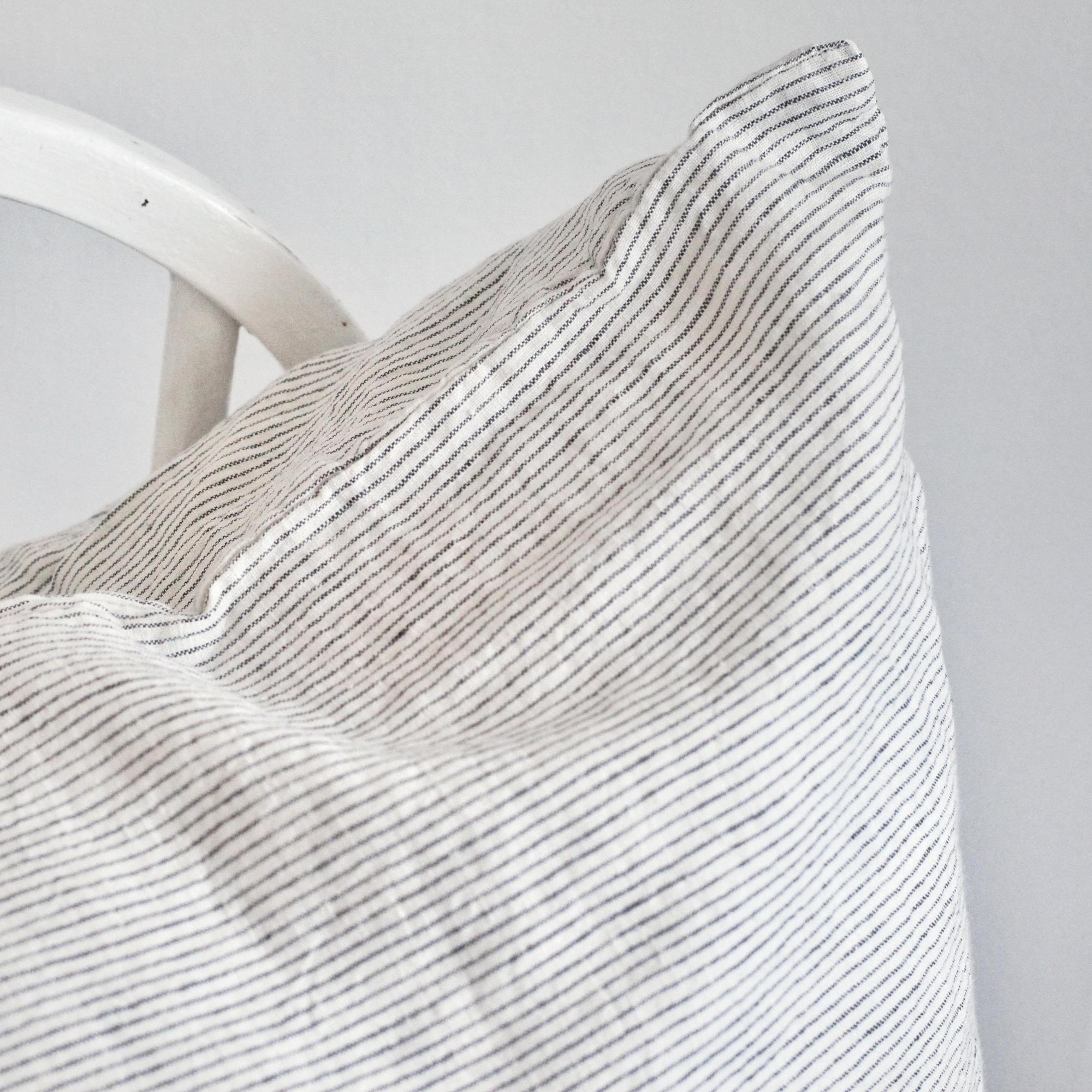 Foxtrot Home French Flax Linen styled in a bedroom with Pinstripes Cushion Cover.