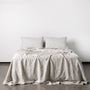 Foxtrot Home French Flax Linen styled in a bedroom with Pinstripe Fitted Sheet.