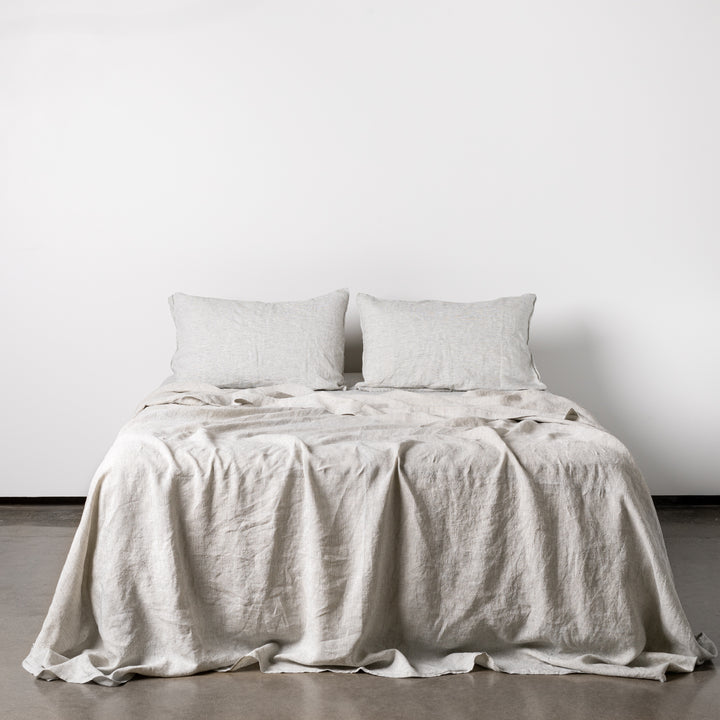 Foxtrot Home French Flax Linen styled in a bedroom with Pinstripe Sheets Sets.