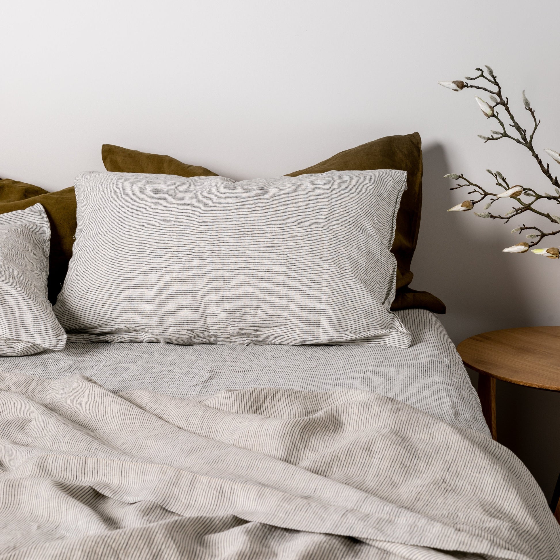 Foxtrot Home French Flax Linen styled in a bedroom with Pinstripe Sheets Sets.