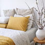Foxtrot Home French Flax Linen styled in a bedroom with Pinstripe Sheets Sets.