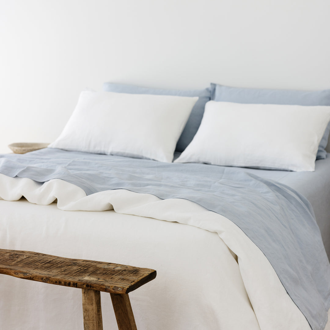 Foxtrot Home French Flax Linen styled in a bedroom with Powder Blue Flat Sheet.
