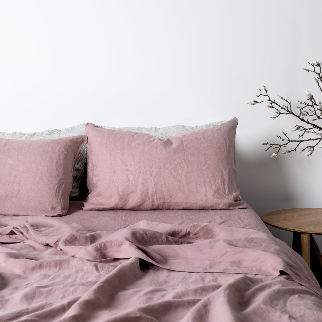 Foxtrot Home French Flax Linen styled in a bedroom with Rosewood Pink Fitted Sheet.